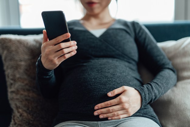 Pregnant woman using contraction timer app