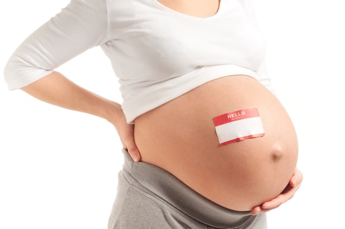 Name tag on pregnant belly