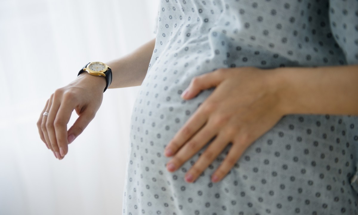 Pregnant woman timing contractions