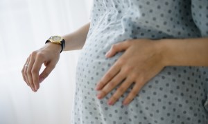 Pregnant woman timing contractions