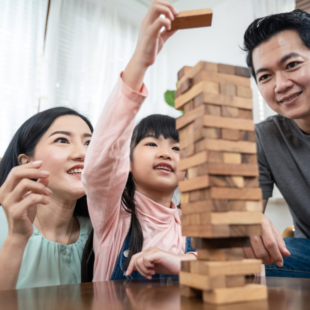 Family playing Jenga together