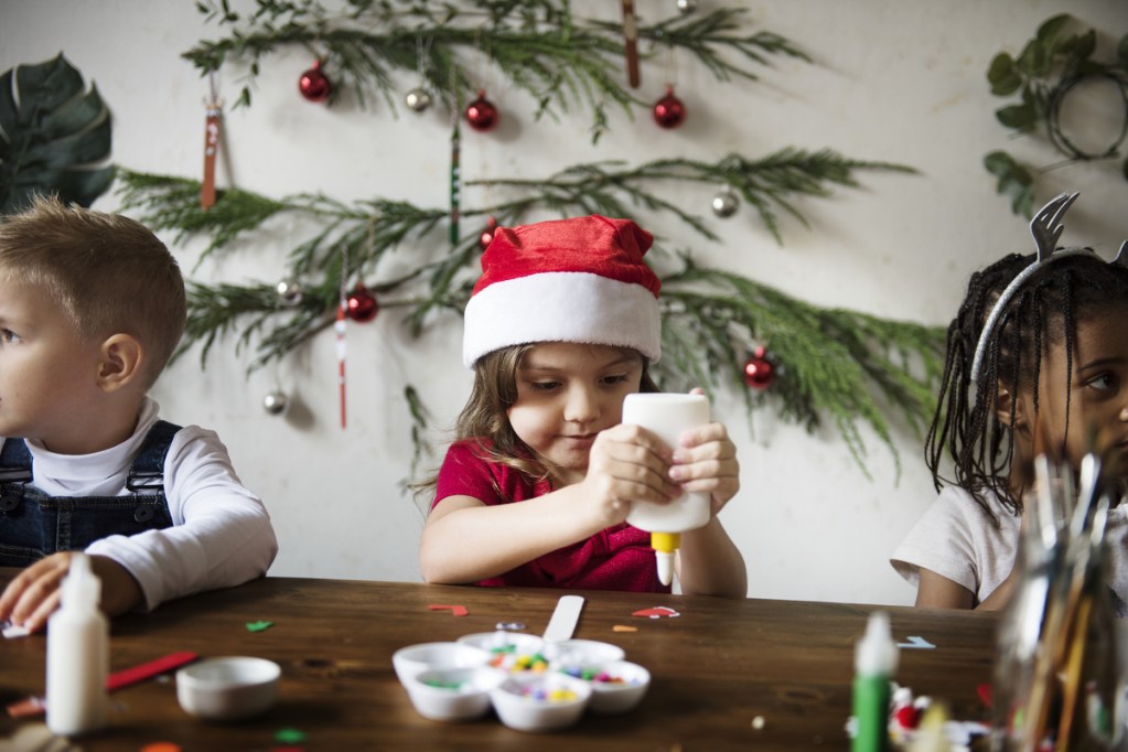 Kids having fun making holiday crafts