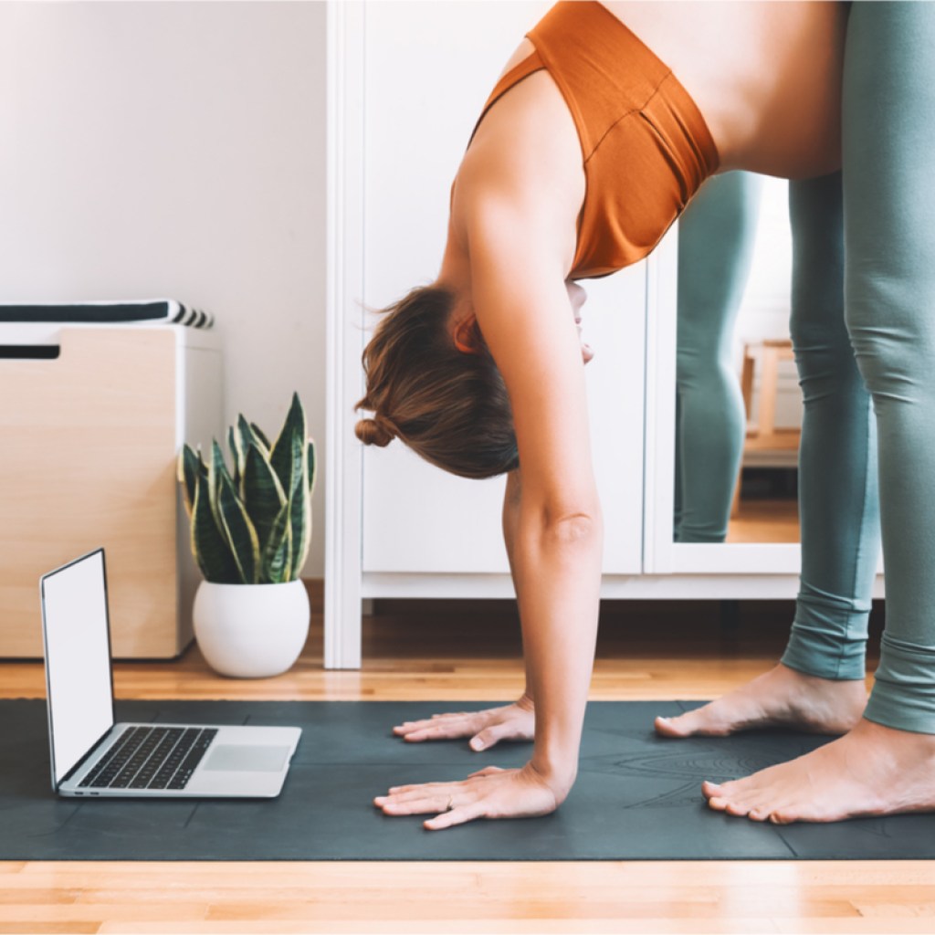 women doing yoga using a pregnancy yoga app