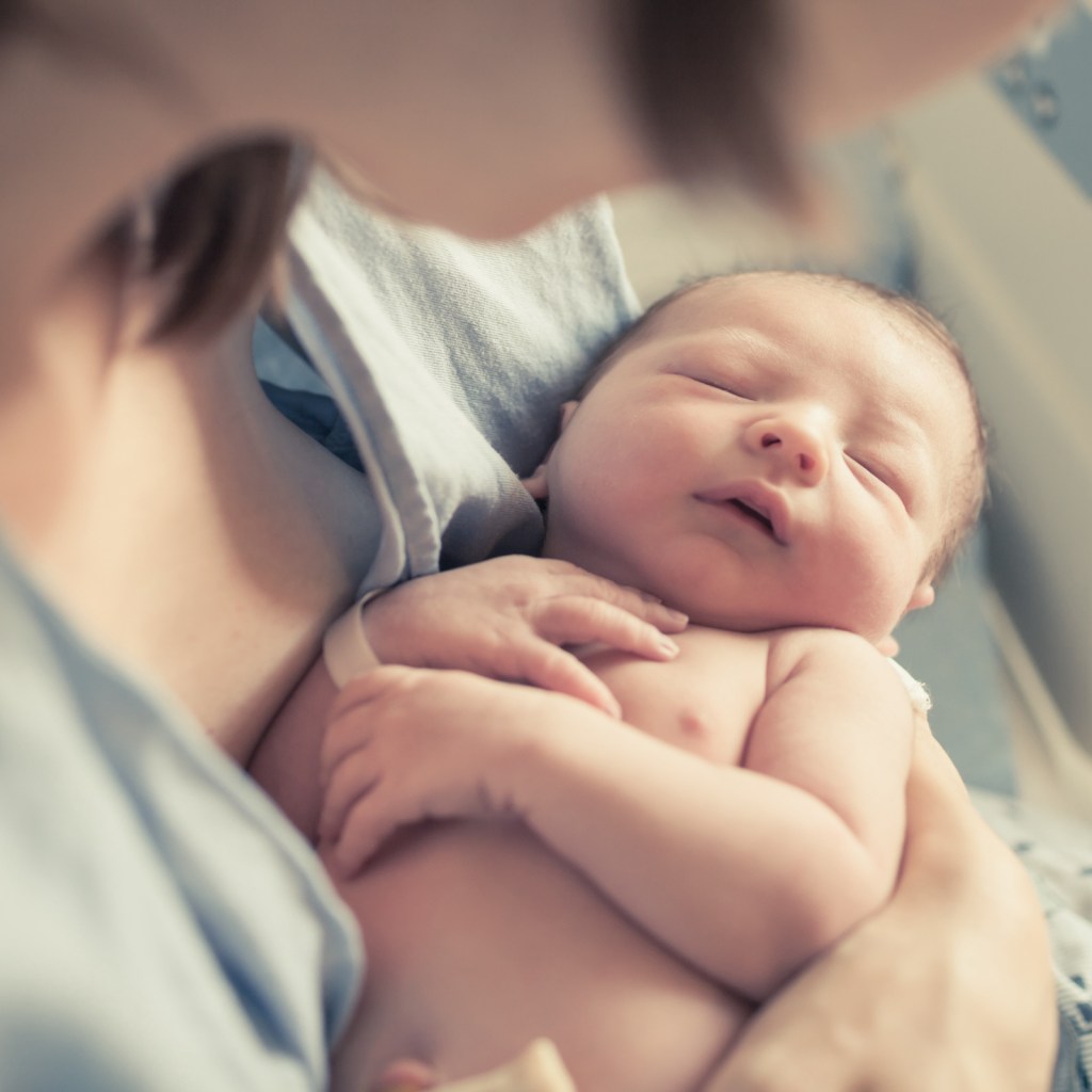 mom holding baby
