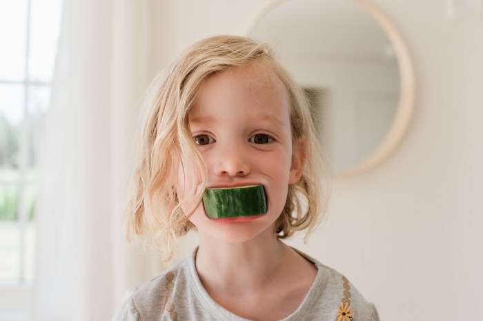 blonde-toddler-with-cucumber-in-mouth-nutrition-guide