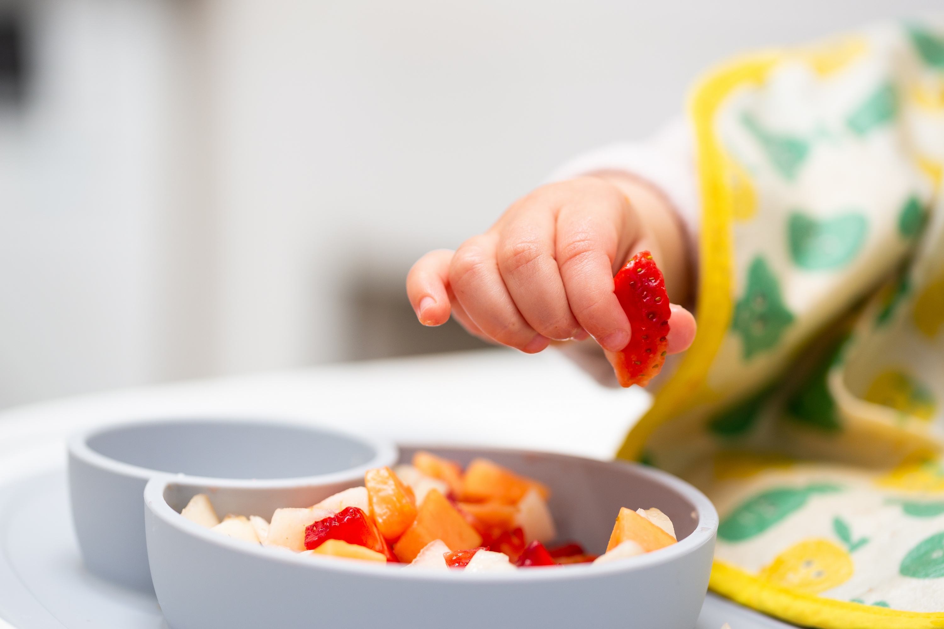 baby eating fruit