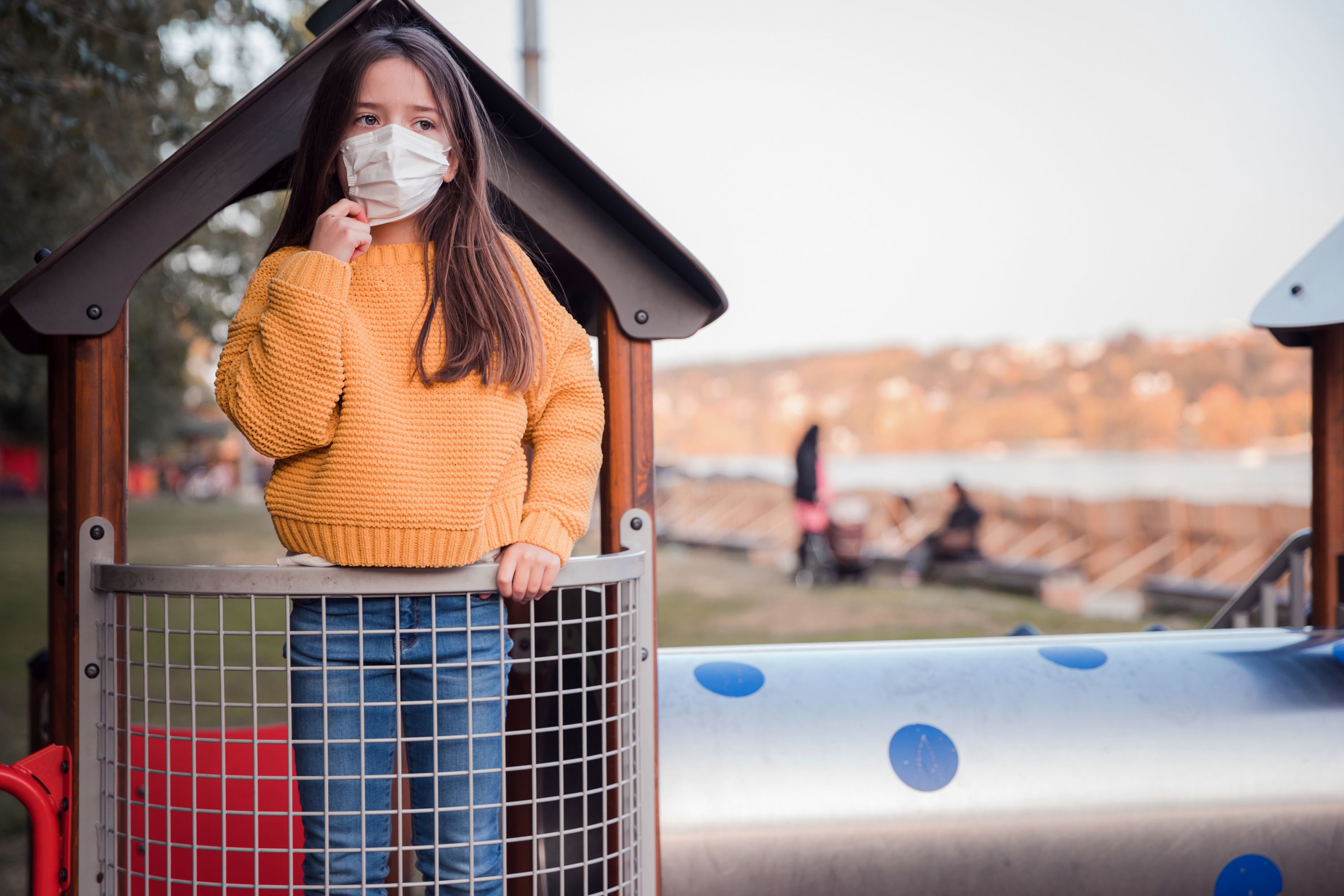 girl-in-mask-playing-at-playground