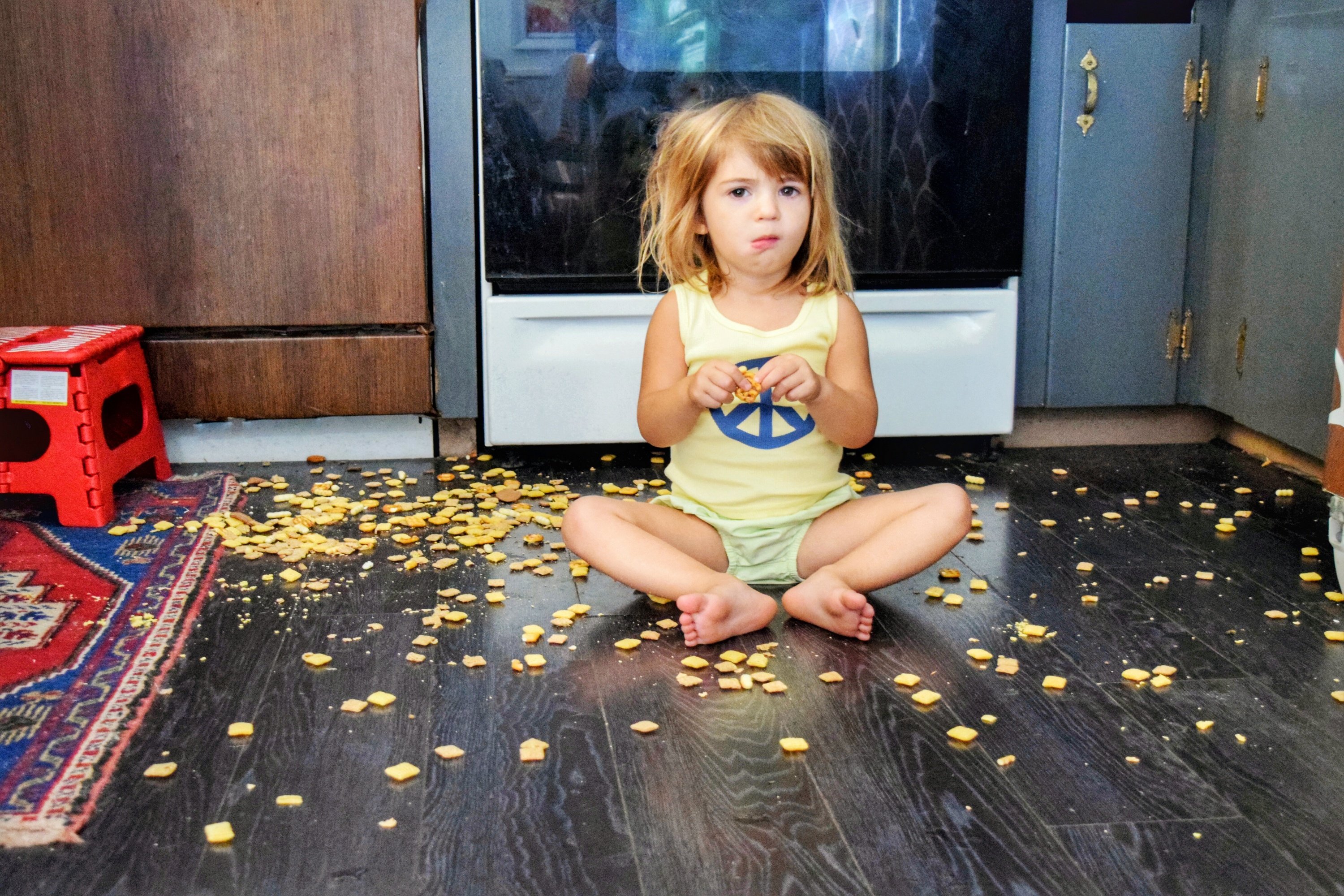Toddler makes a mess on the floor