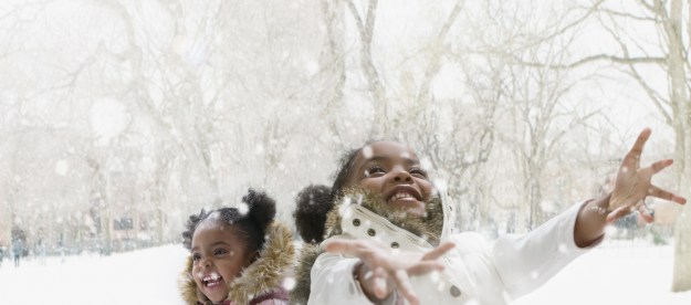 Kids enjoying snow as an outdoor activity