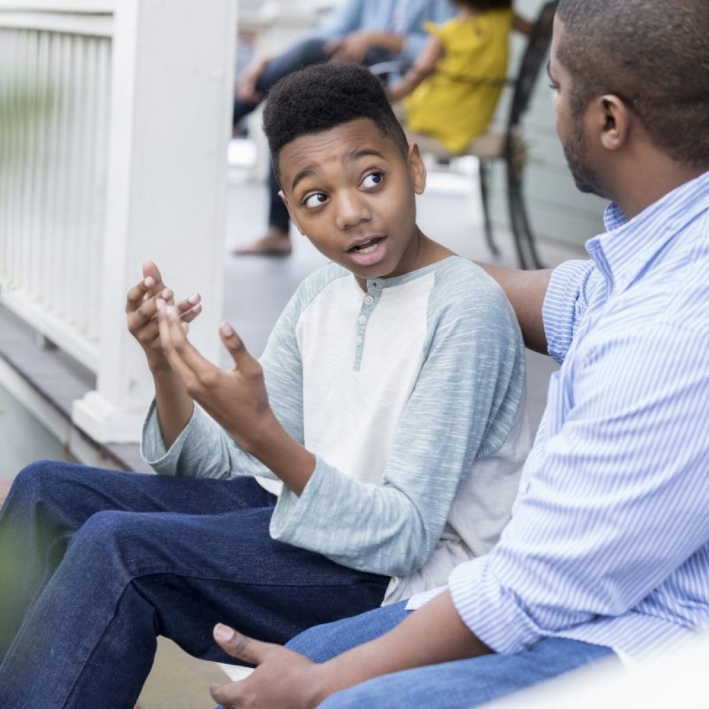 Father and son having a discussion.