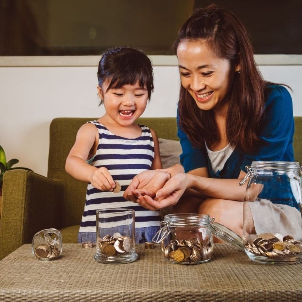 mom and daughter counting coins