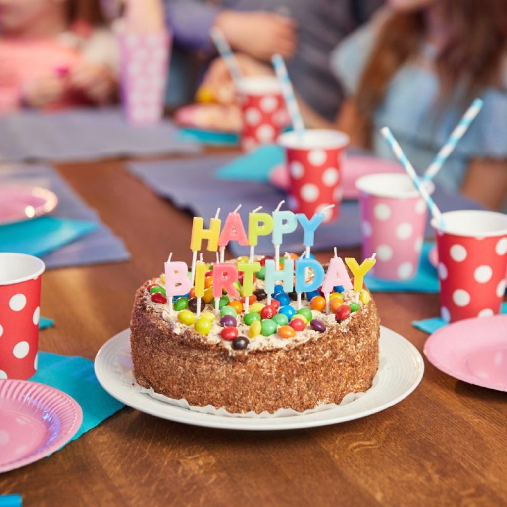 Delicious birthday cake with candles.