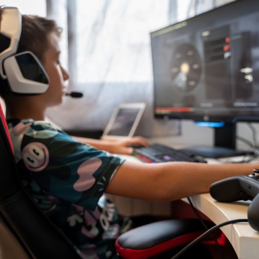 Teen playing a video game