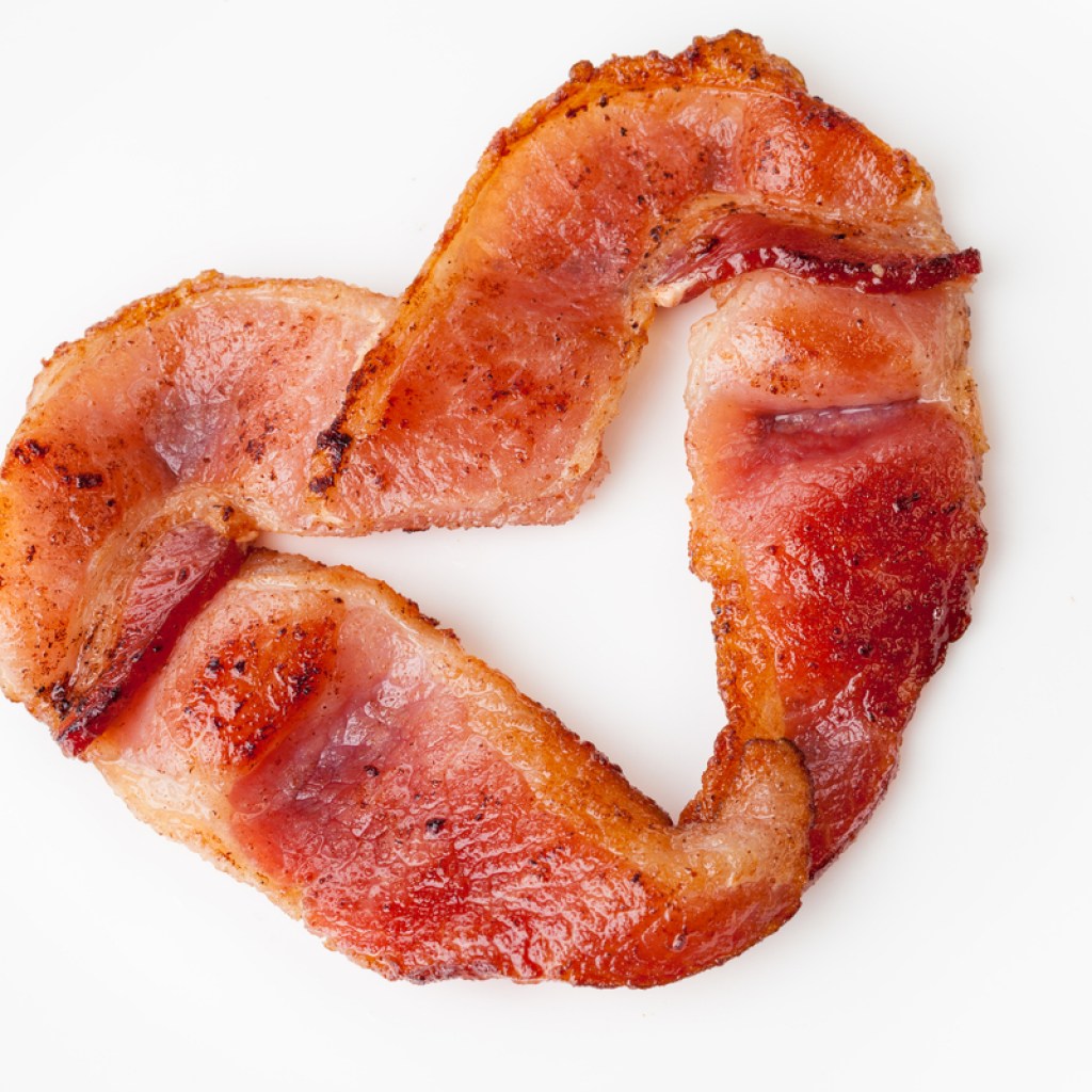 slice of bacon shaped in a heart
