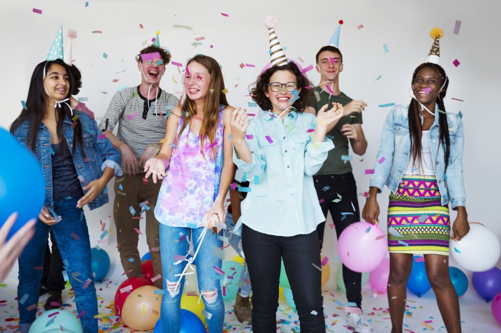 Teens having fun at a birthday party.