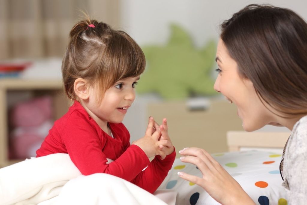 Toddler and mom talking