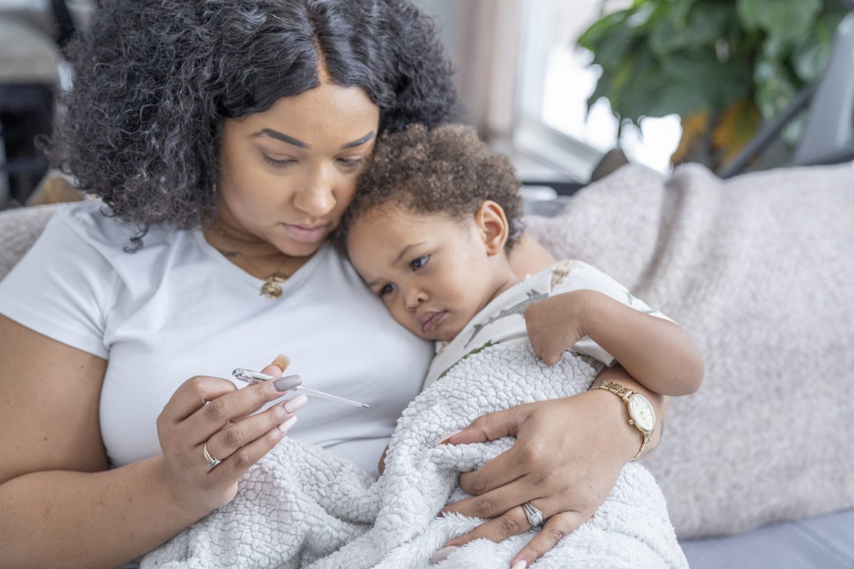 A parent taking care of a sick child.