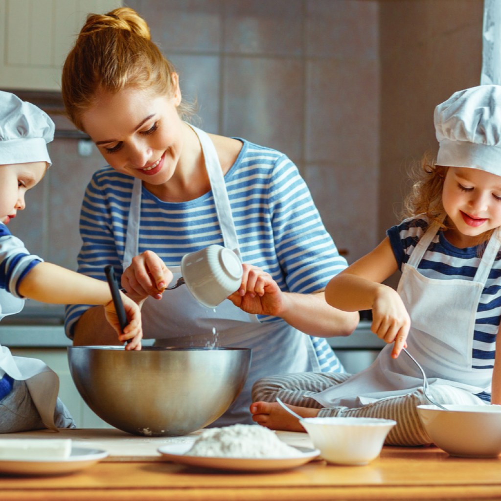 Mom and kids baking a cake