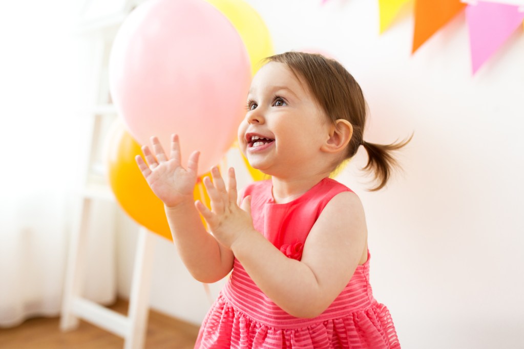 Little girl having fun playing party games