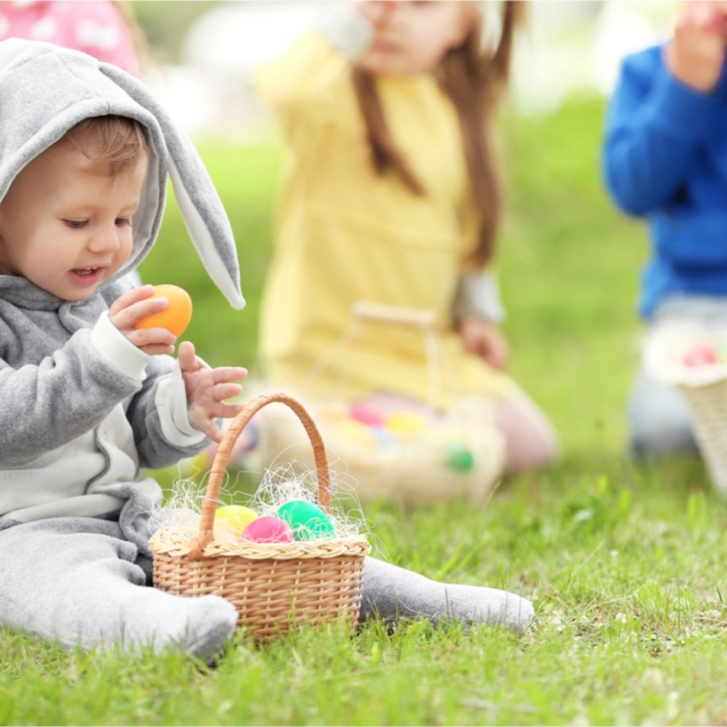 baby dressed as a bunny on an egg hunt