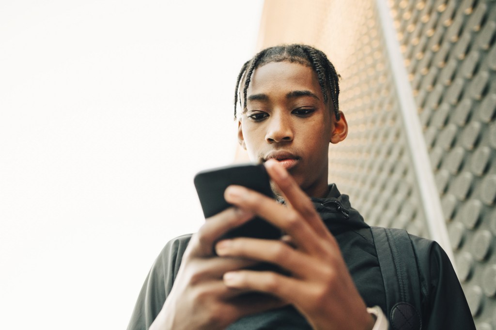 Teen using a cell phone.
