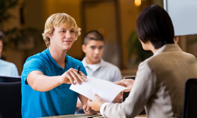 Teen turning in an application.