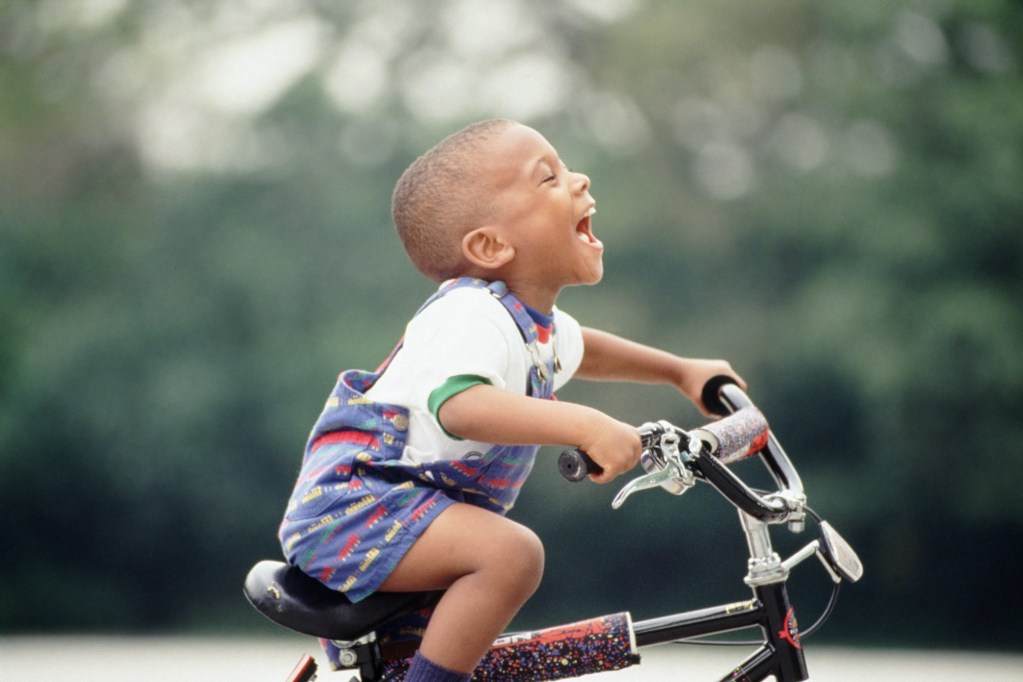 little boy riding a bicycle