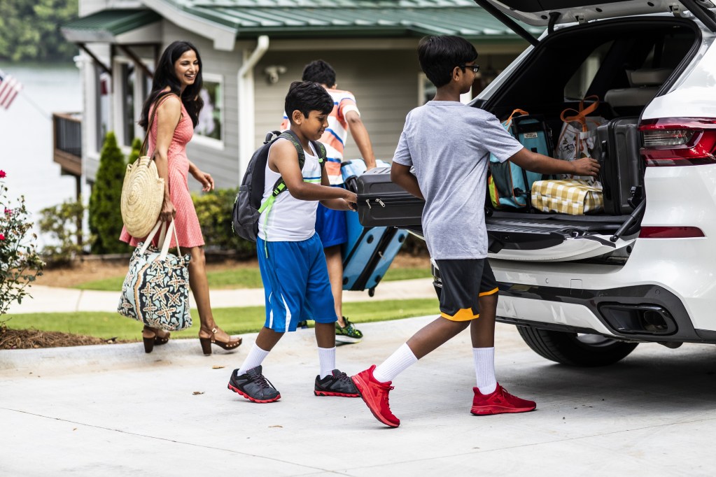 Family packing the car for a road trip