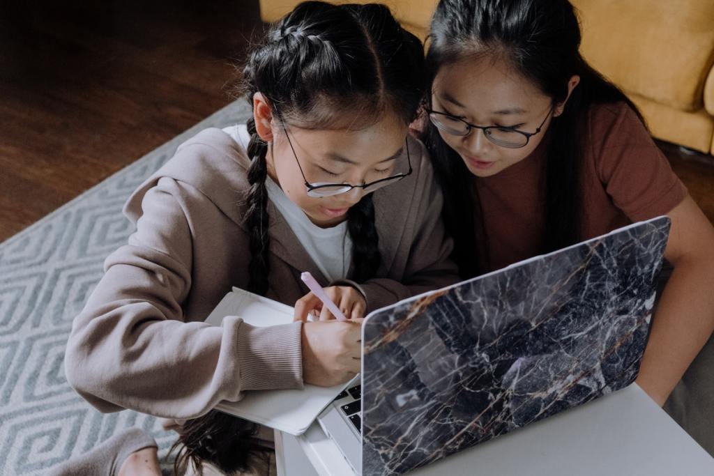 Mom helping daughter with homework