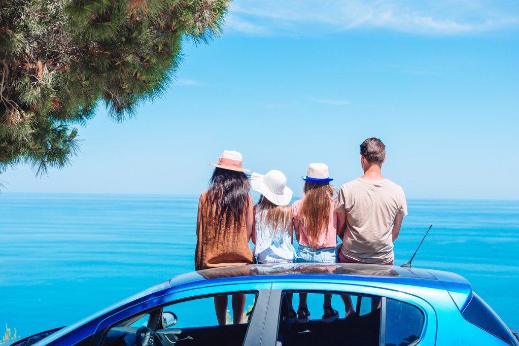A family on vacation taking a break to look at the view