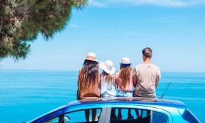 A family on vacation taking a break to look at the view