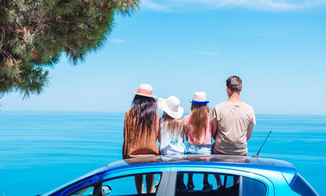 A family on vacation taking a break to look at the view