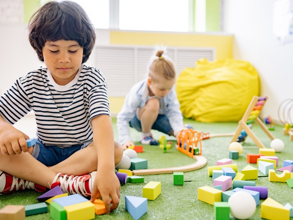 Boys building with blocks and creative toys.