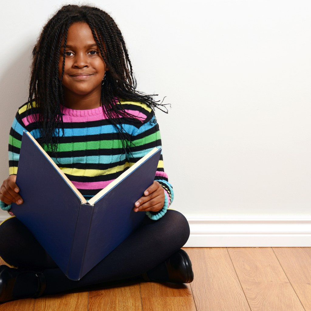 Young girl reading a book