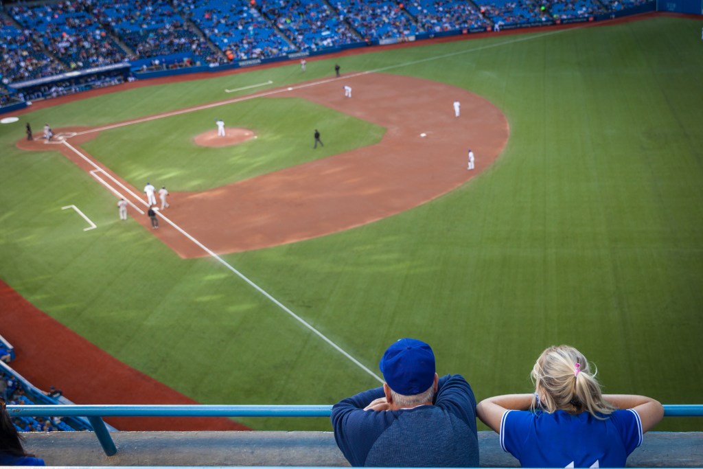 Dad and daughter enjoy baseball game on Father's Day