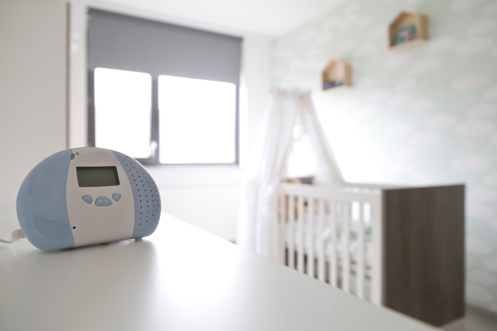 A white nose machine in a baby's bedroom.