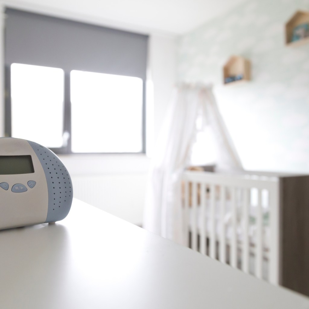 A white nose machine in a baby's bedroom.