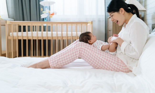 A mother singing to her little baby.