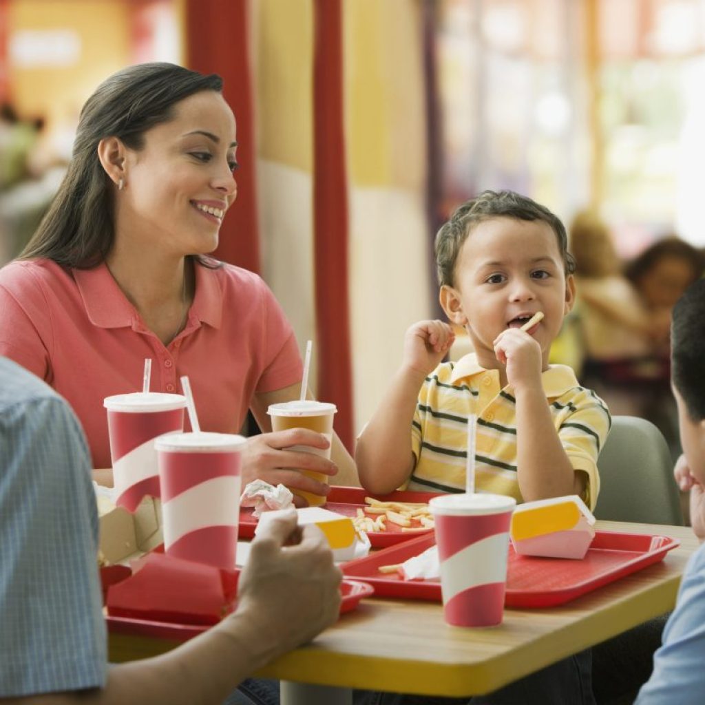 A family enjoying a fast-food meal together