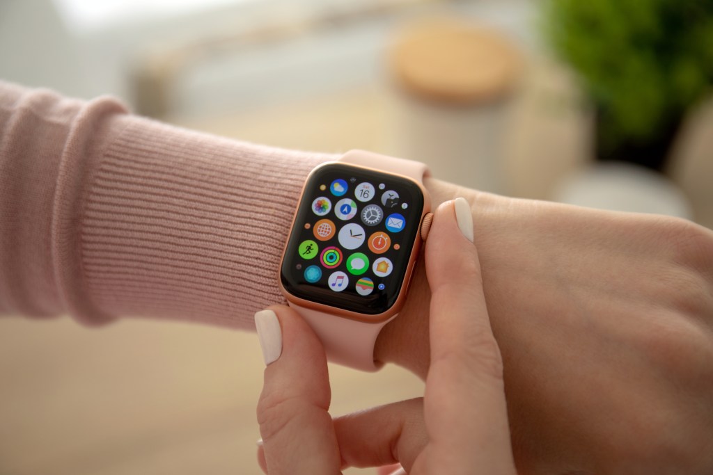 A person checking their Apple watch.