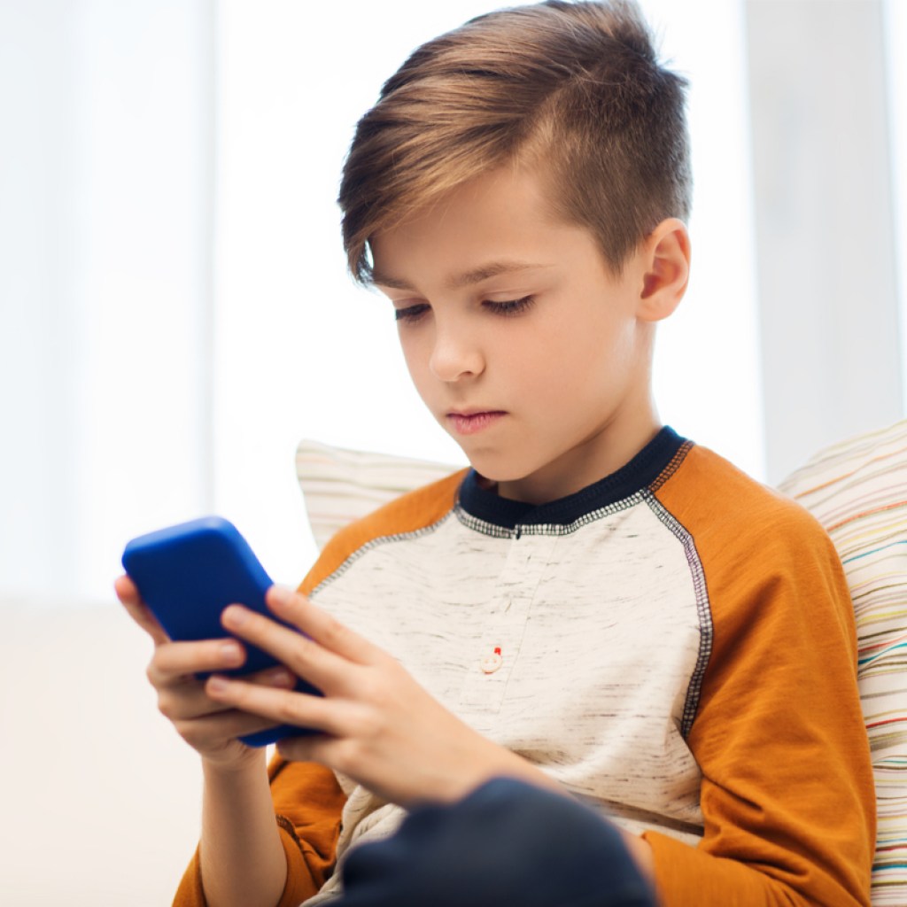 Boy using cell phone responsibly
