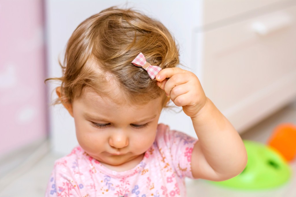 Toddler Pulling Hair? What This Troubling Sign Means | NewFolks