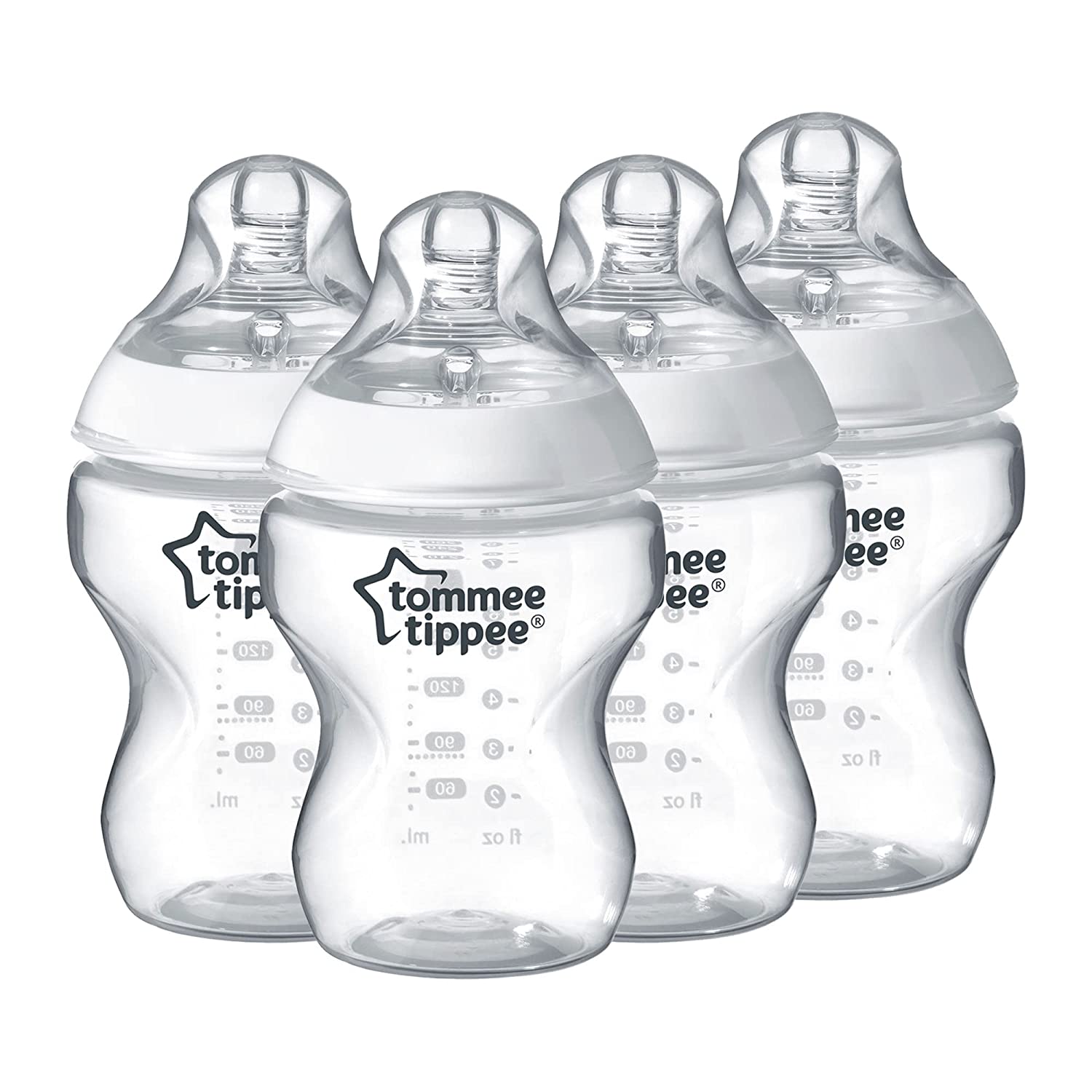 Four empty baby bottles on a white background.