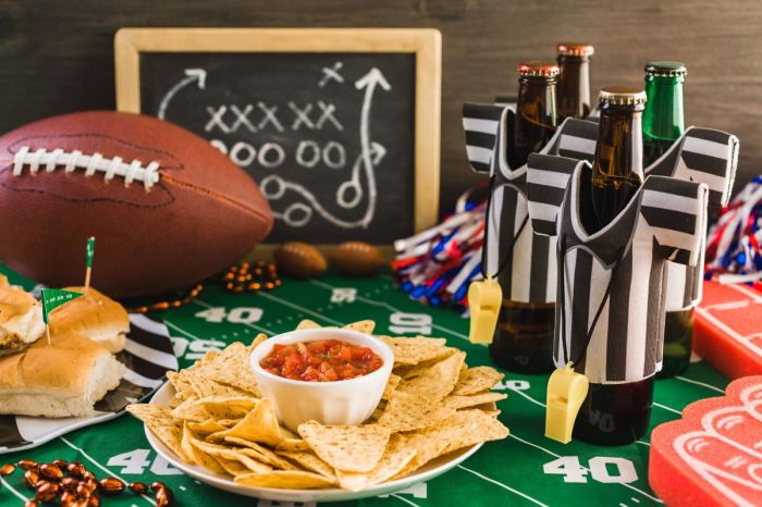 Table filled with snacks ready for a Super Bowl party