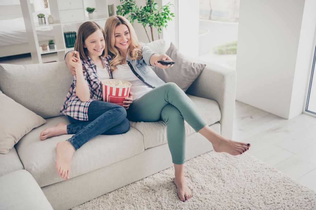 Mom and teen watching TV