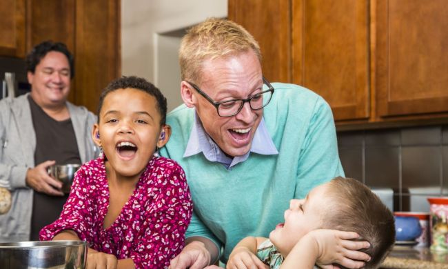 Family laughing with their dad