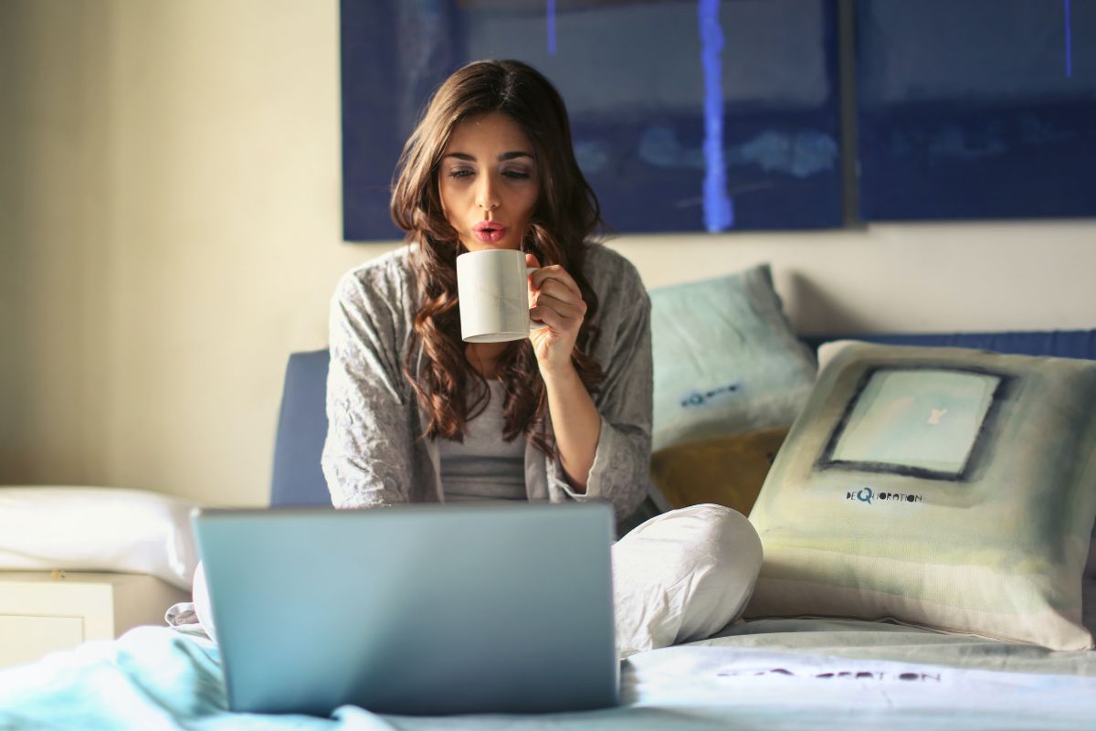 Woman with coffee and laptop