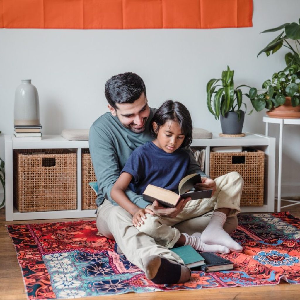 A parent reading to a child