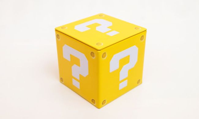 Yellow riddle box with question marks on it