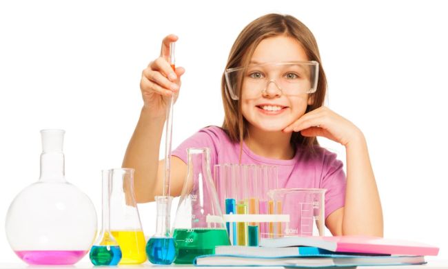 Smiling girl with chemistry set